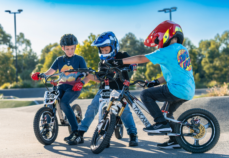 Talaria Electric Dirt Bike on rugged off-road trail with sleek design and electric motor