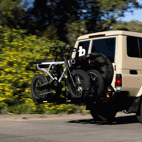 Mo-Tow 2 E-Bike carrier mounted on tow bar carrying two Fatboy bikes with integrated loading ramp